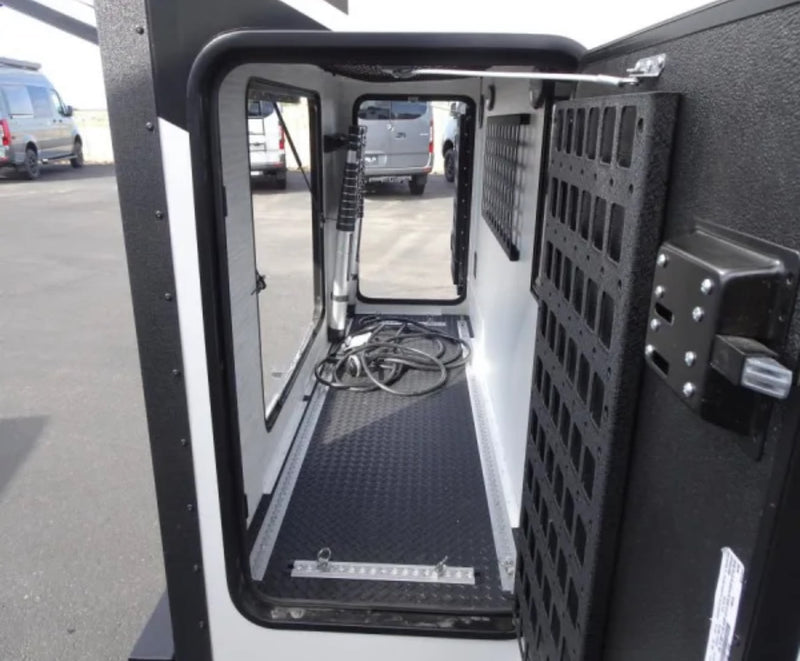  and a fire extinguisher.|RV rental interior: Looking in from the entry step at a light-toned dinette — photo 12