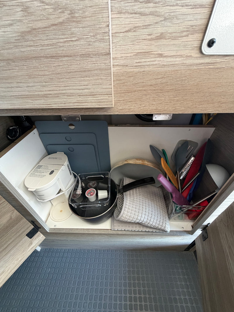  and a bright sandy beach view out the rear window.|RV rental kitchen sink — photo 12