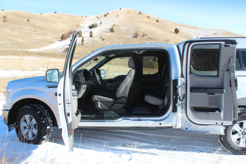  showing detailed front & rear seating.|A silver Ford F-150 truck with open doors in a snowy landscape. A versatile vehicle for any adventure — photo 20