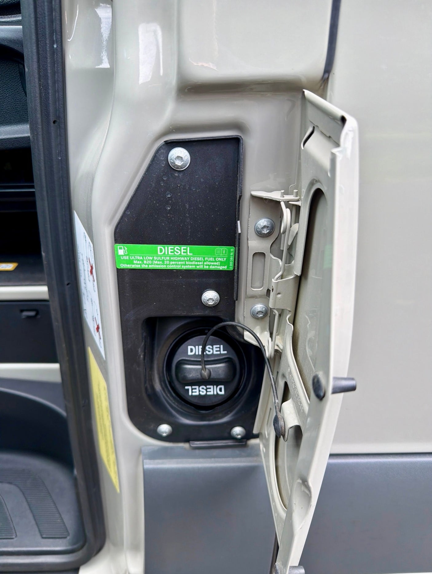RV rental's open fuel door reveals the diesel filler cap & a warning: Ultra-low sulfur diesel fuel only, max B20.