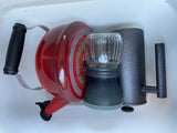 Red kettle, oil lamp, and smoke generator — practical items for your RV rental adventures.