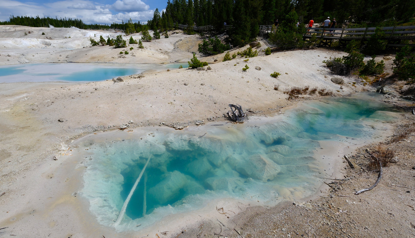 Explore vibrant geothermal pools & scenic boardwalks in a national park. Perfect for an RV rental adventure!