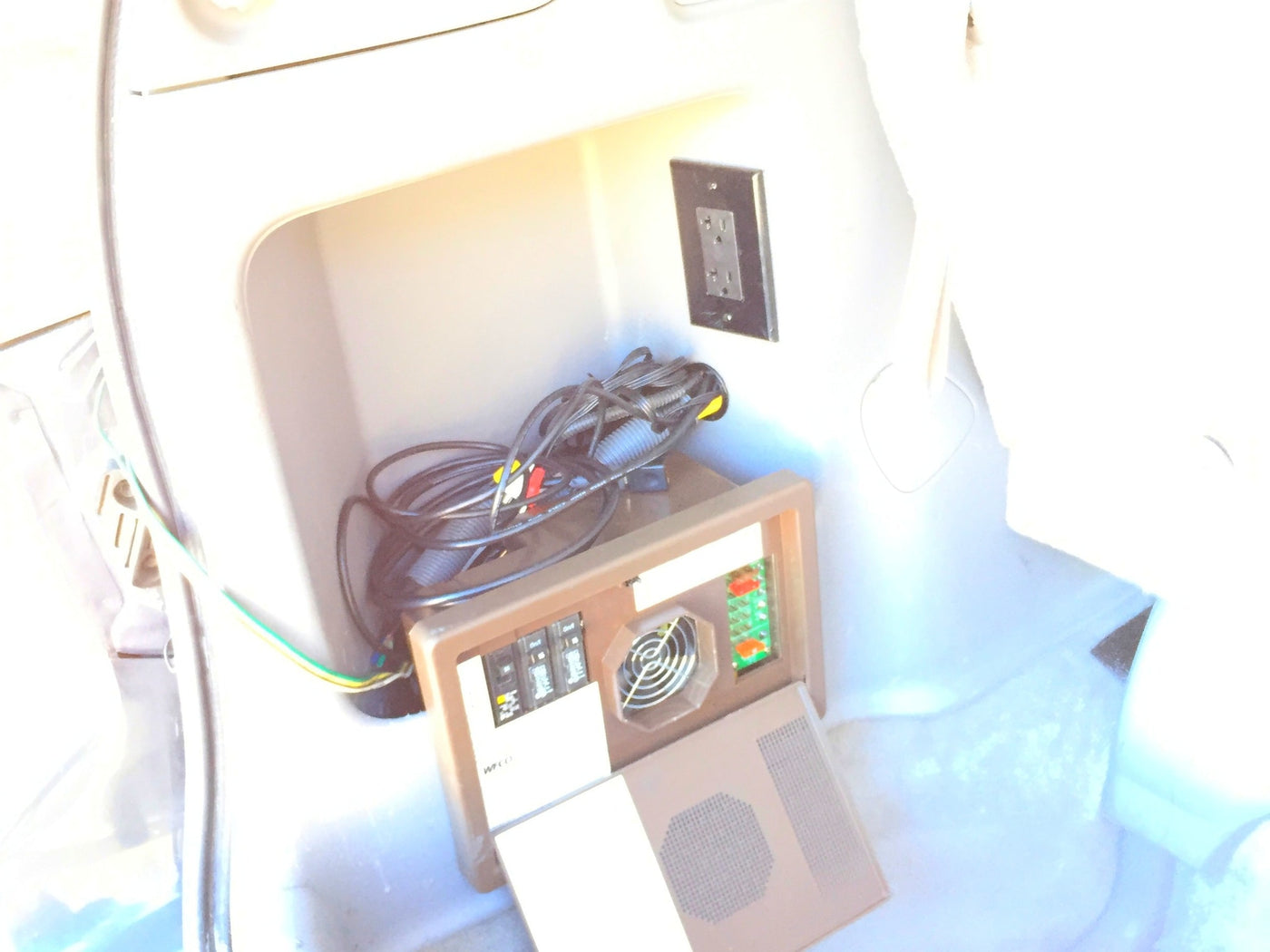  offering a comfortable space with rear passenger seats.|RV rental: Roof-mounted tent and open fan unit on a vehicle — photo 14