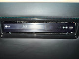 LG Blu-ray Disc player providing entertainment in an RV rental. Visible power button & USB port for media.