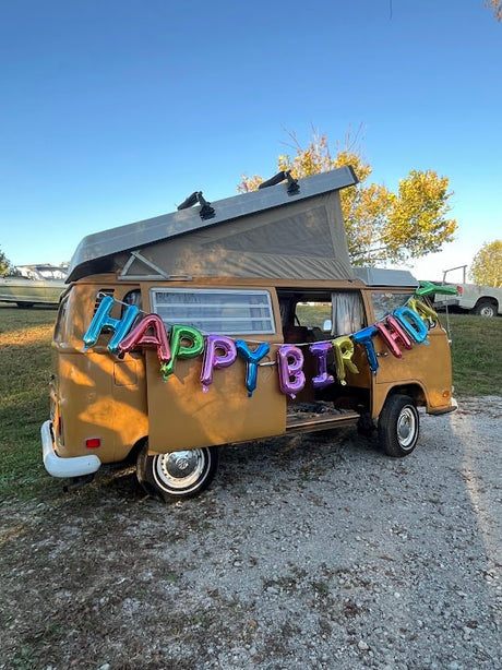 A festive "Happy Birthday" VW camper van, ideal for your next rv rental adventure and celebration.