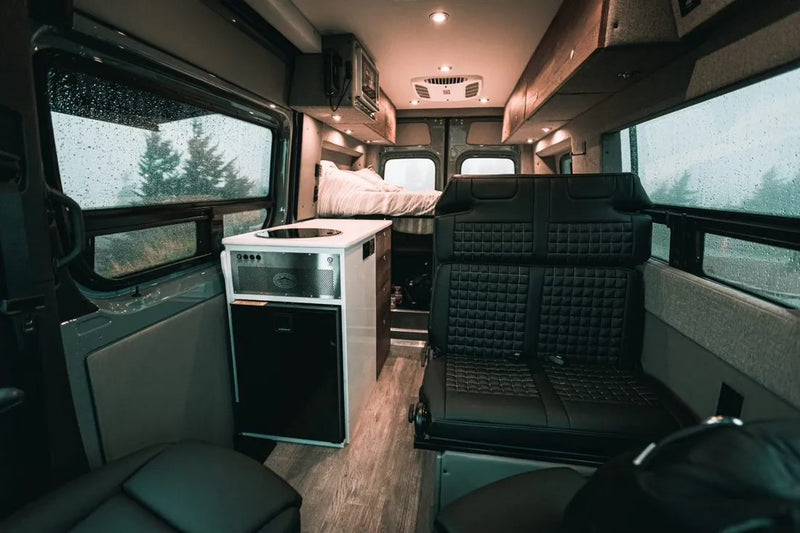  and storage for van life adventures.|Cozy RV rental interior: comfortable bed — photo 5