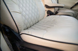 Cream upholstered seat with black diamond stitching and piping details. Ideal comfort for your RV rental.