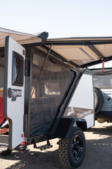 TigerMoth off-road trailer for RV rental. Experience camping adventure with its open awning and mesh side.