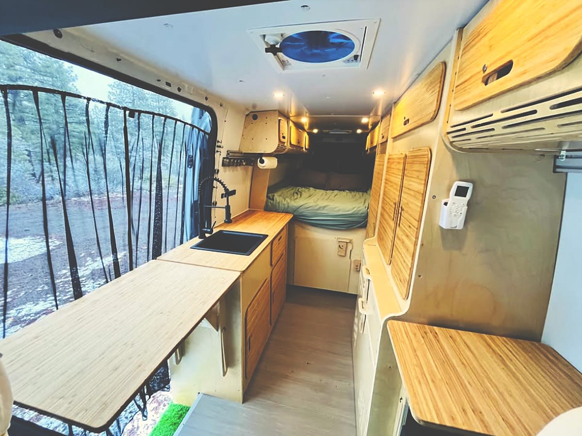 An rv rental van's interior: a compact kitchen