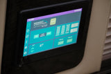 RV rental interior: A digital control panel shows 9:49 AM, lights, temperature (71°/81°), empty tanks, and 14.5V battery levels.