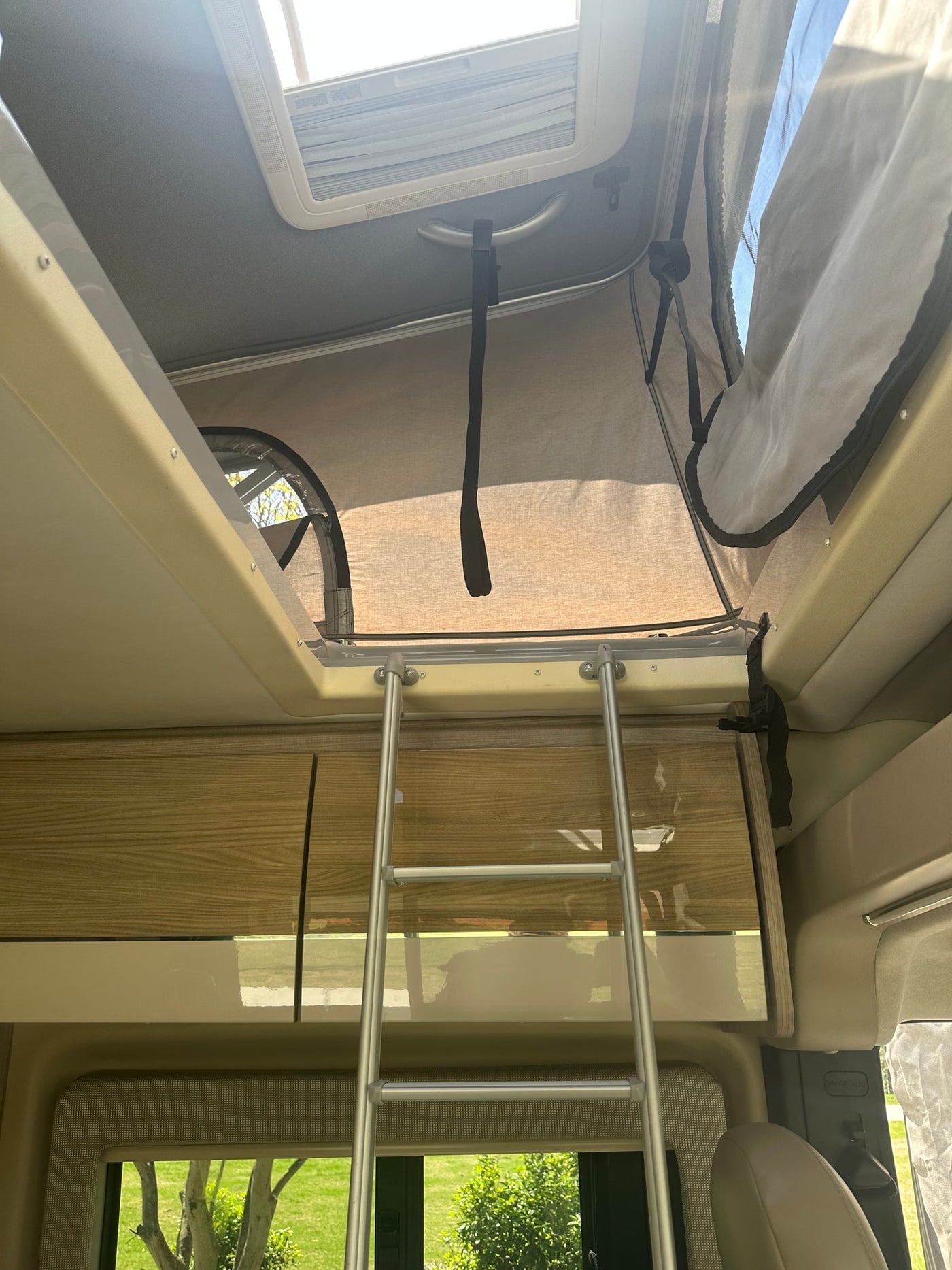  perfect for road trips.|Modern rv rental interior showcasing a living area with TV — photo 7