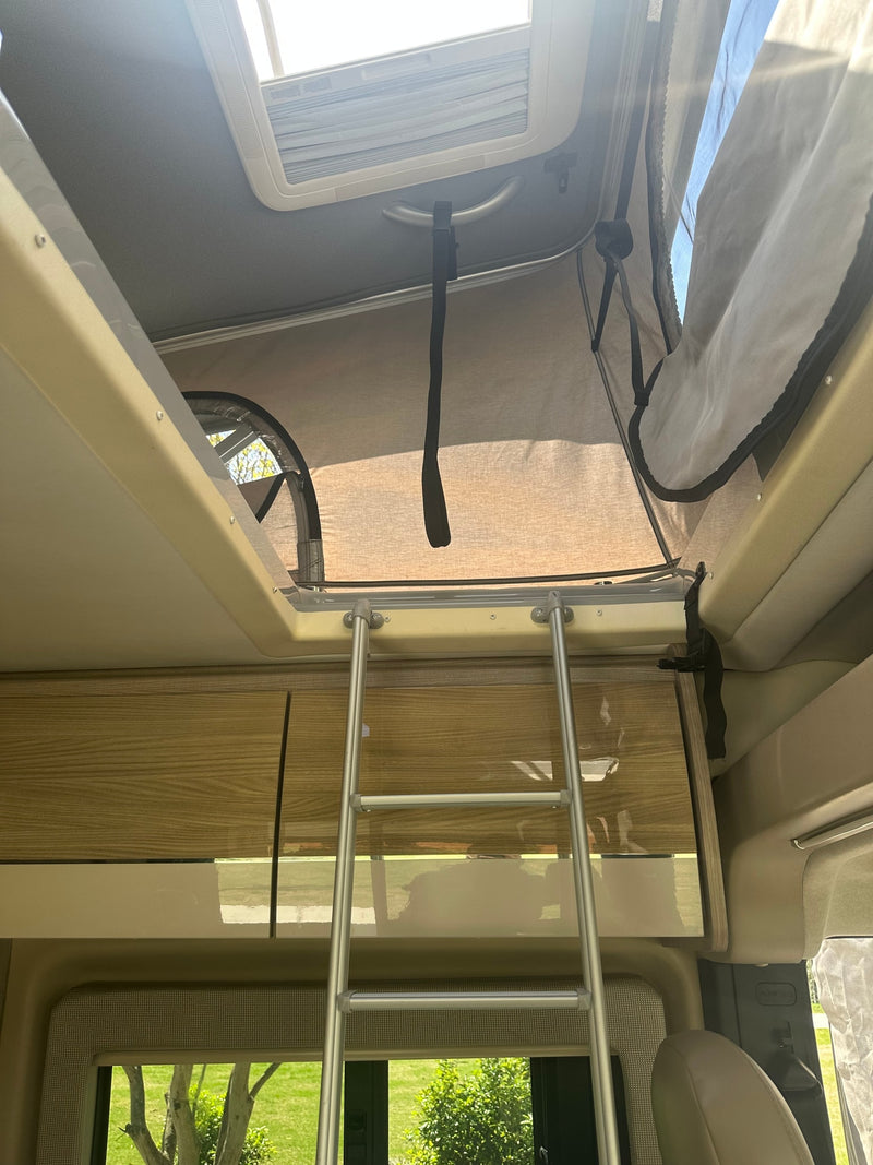  perfect for road trips.|Modern rv rental interior showcasing a living area with TV — photo 7