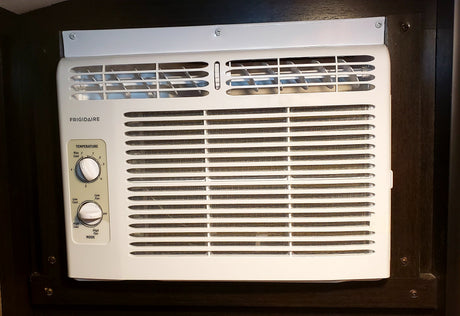 Frigidaire RV air conditioner controls (temperature, fan, mode) for cooling comfort in an RV rental.