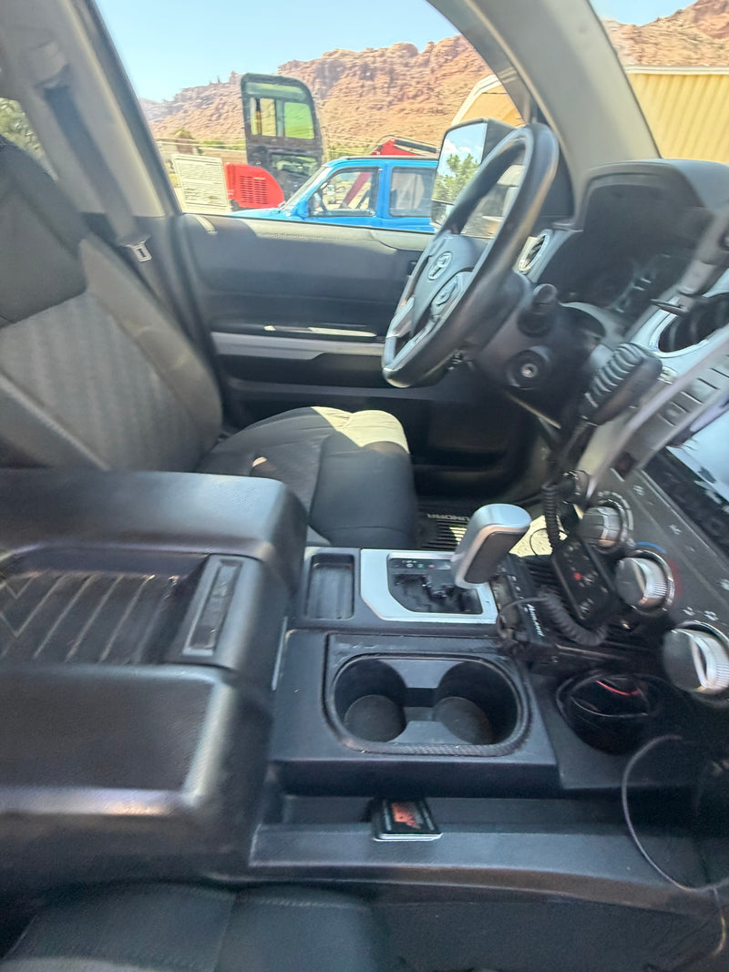 Truck cab interior (Toyota Tundra) with radio, gear. Mountains & equipment outside, great for a rugged rv rental adventure. — photo 1