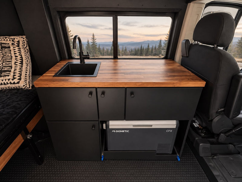  snow-capped mountains and a vast plain.|Explore in this dark gray Ram ProMaster off-road rv rental camper van — photo 10