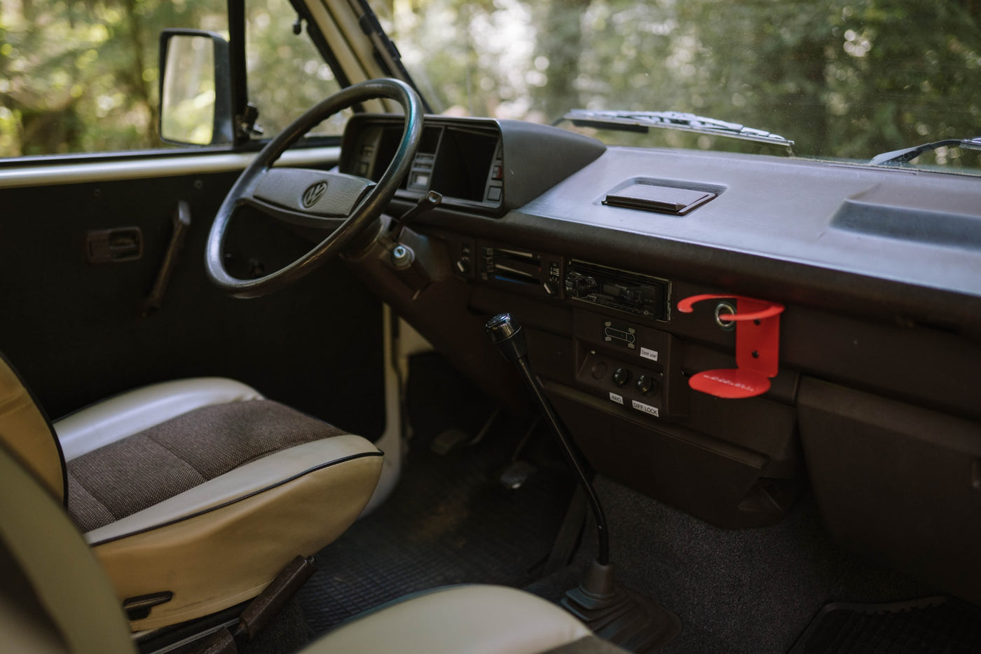  on a forest road. Washington plate "DAISY01" visible.|White 4WD camper van with roof rack parked on a forest dirt road — photo 6
