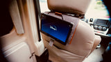 Inside an RV rental: A tablet displaying Disney+ is mounted on a seat's headrest, ideal for travel entertainment.