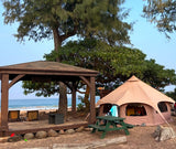 Beachfront glamping: A large, unique tent and gazebo offer a cozy alternative to an RV rental, with ocean views.