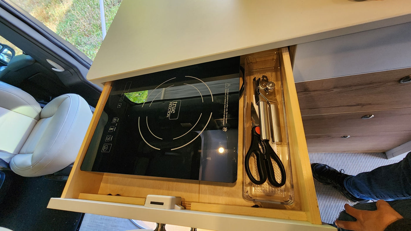 RV rental's smart kitchen: a slide-out True Induction cooktop & tools in a drawer. — photo 20