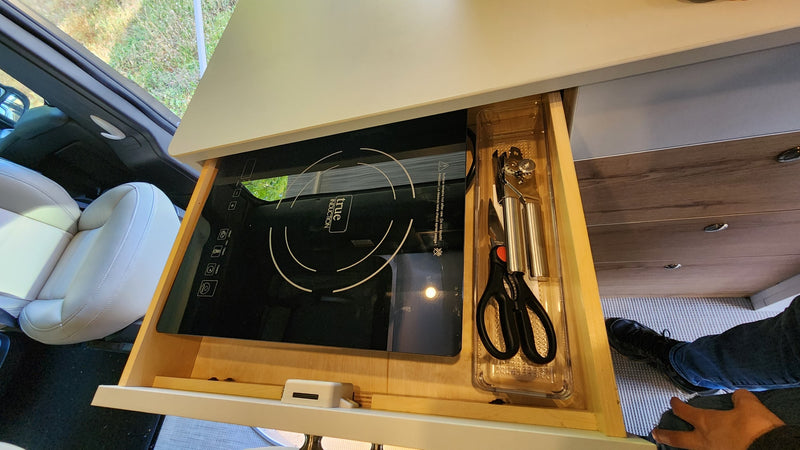 RV rental's smart kitchen: a slide-out True Induction cooktop & tools in a drawer. — photo 20