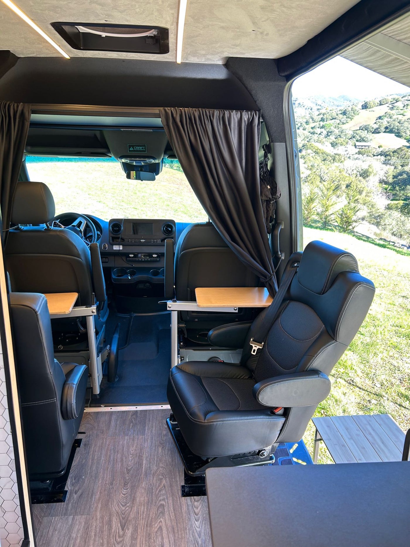  overlooking mountains.|Explore van life! This custom camper van interior — photo 8