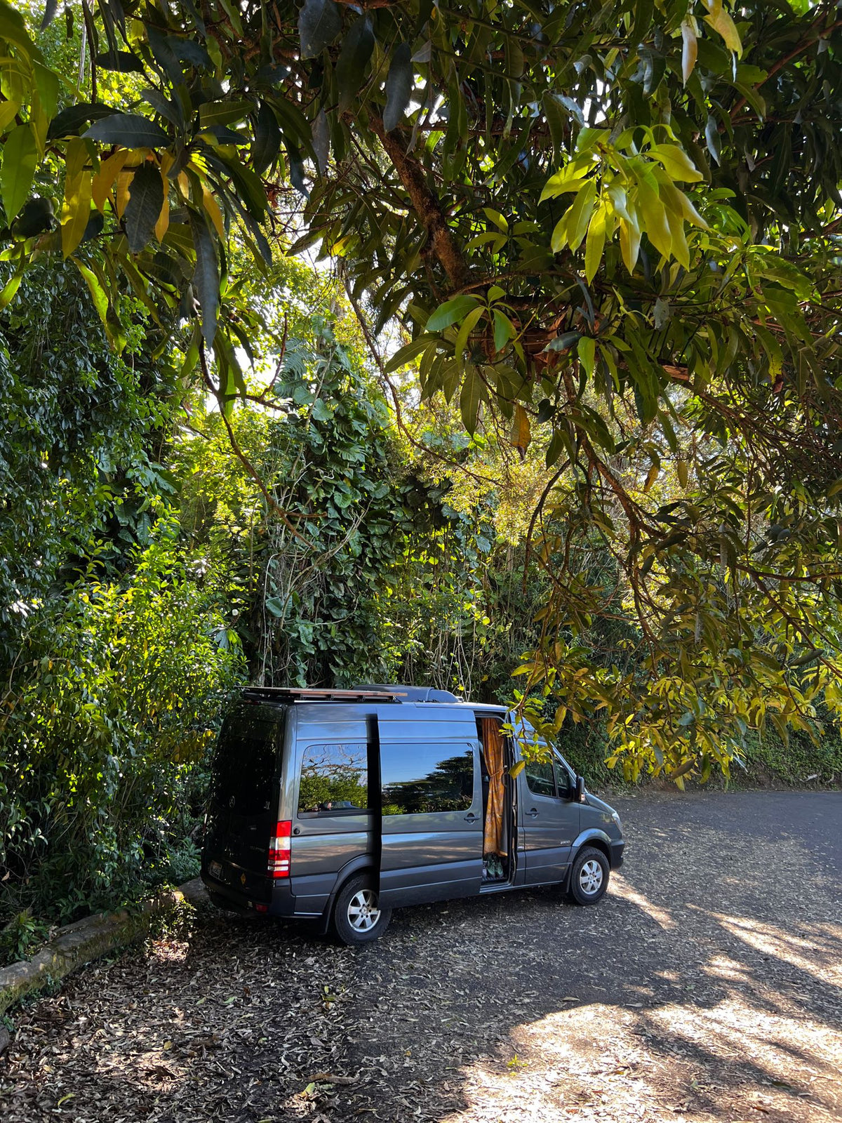  with distant land. A solar panel on a wooden deck suggests an RV rental setup.|Step inside this RV rental's clever interior: a padded door — photo 11
