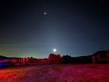 Stars, planets & illuminated art light up this desert night. Book an RV rental for your unique astrophotography escape!