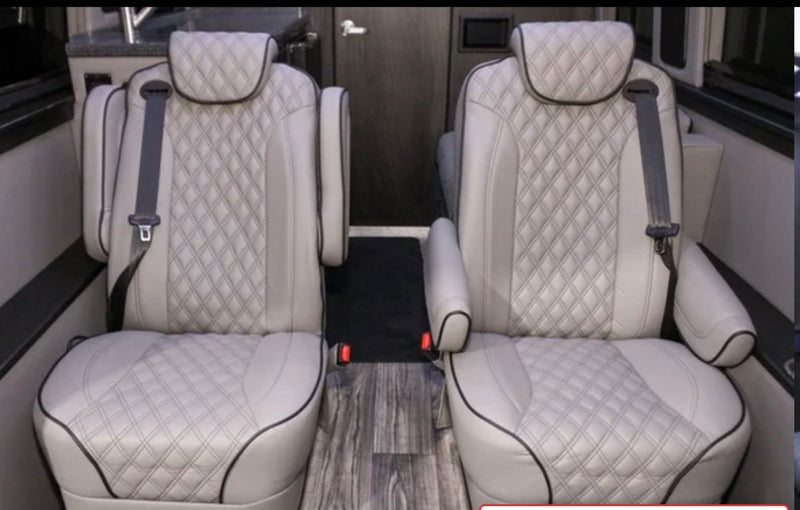 Plush, diamond-quilted captain's chairs in an RV rental interior, offering comfort for passengers. — photo 8
