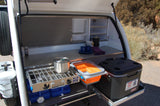 This RV rental's pull-out outdoor kitchen offers a stove, cooler, and smart storage for convenient camping meals.