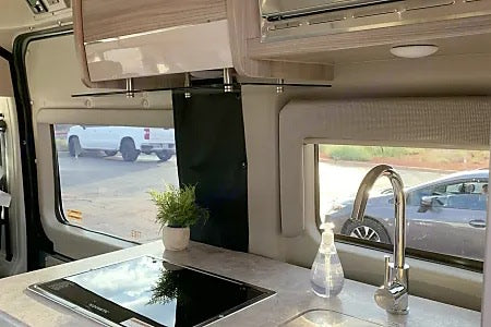  ideal for exploration.|Modern RV rental kitchen with cooktop — photo 2