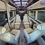 Experience premium travel with this RV rental's lavish interior: cream leather captain's chairs, wood flooring, and an Apple TV system.
