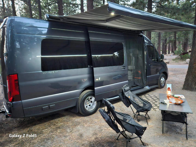  and wood floors for comfortable travel.|Interior of a modern RV rental. Features a compact kitchen with sink — photo 1