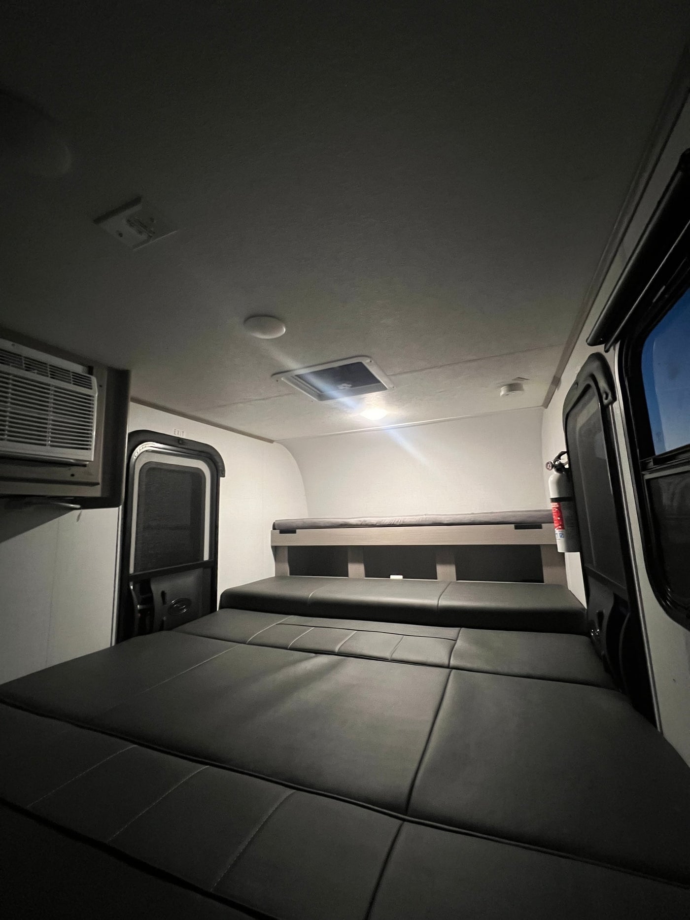  ready for your rv rental.|Inside an RV rental: a cozy sleeping area with convertible seating — photo 2