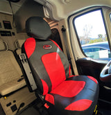 RV rental: Inside, a red & black swivel seat, Winnebago control panel, & rear seating for comfortable travels.