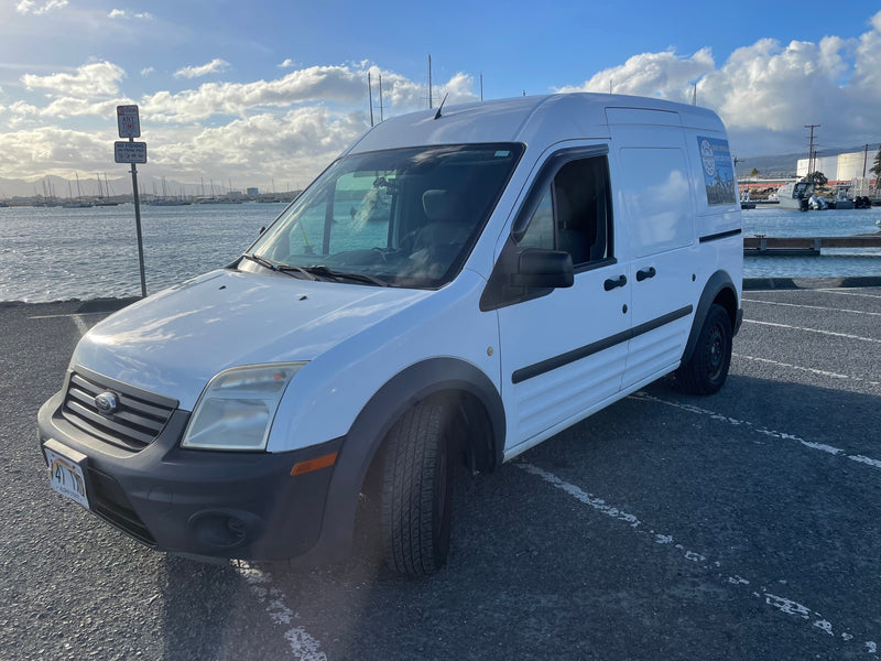  useful for RV rental power & jump-starting.|White Ford van for ebike rentals — photo 2
