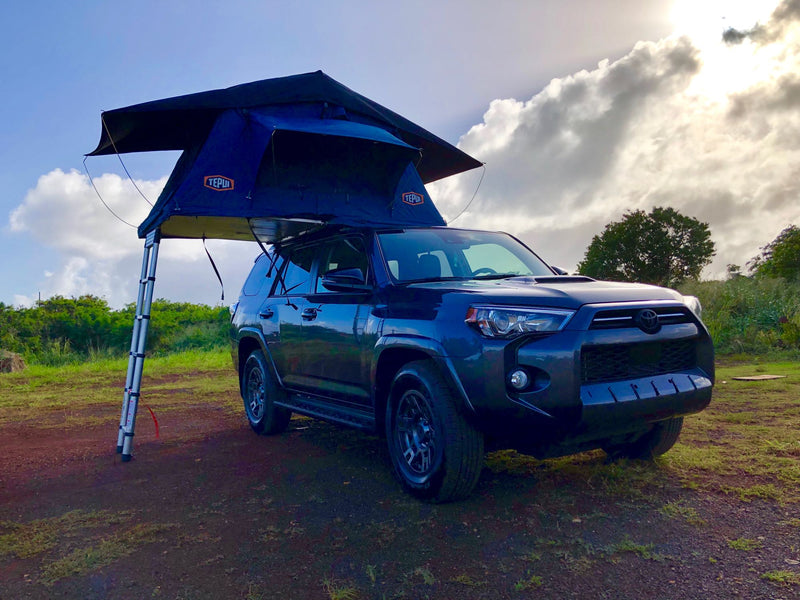 This dark grey Toyota 4Runner with a Tepui rooftop tent offers a unique RV rental camping adventure in the outdoors. — photo 8