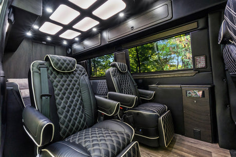 Step into luxury with this RV rental's custom black leather interior, featuring diamond-stitched seats and ambient lighting.