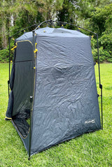 Freestanding grey privacy tent on grass. Perfect for RV rental adventures, camping, or outdoor changing.