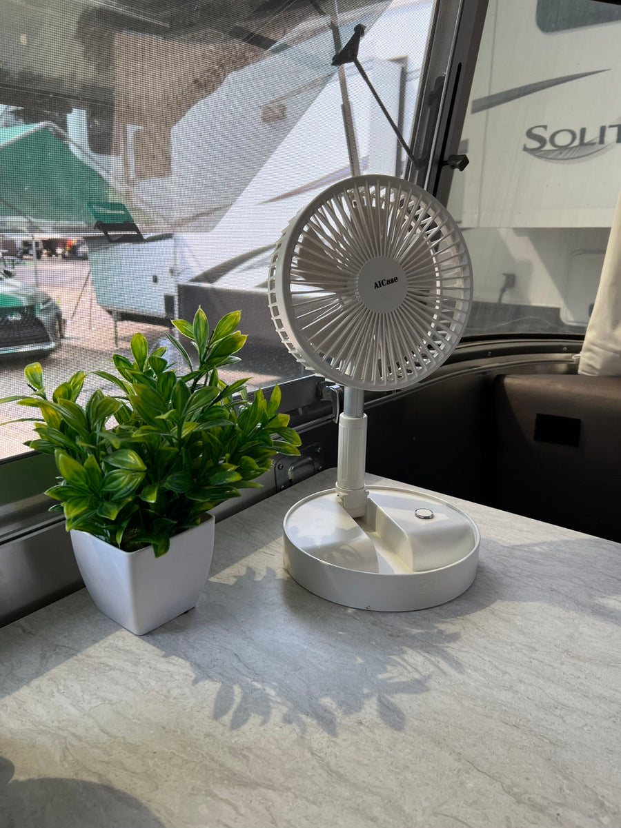  and a cozy bedroom.|RV rental's compact wet bath: a toilet