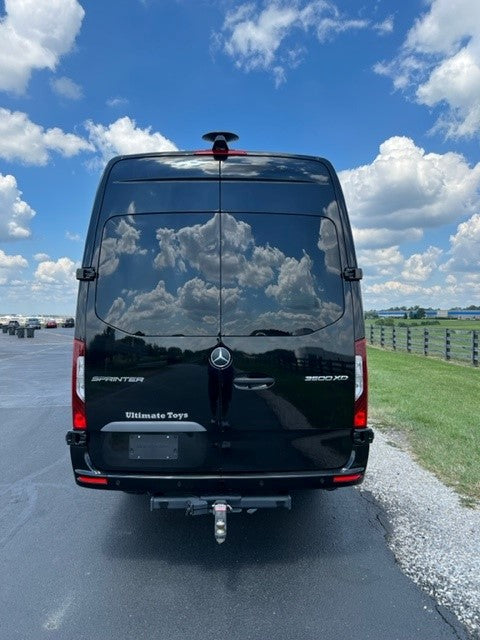 Rear view of a black Mercedes-Benz Sprinter 3500 XD van by Ultimate Toys, ready for your luxury rv rental.