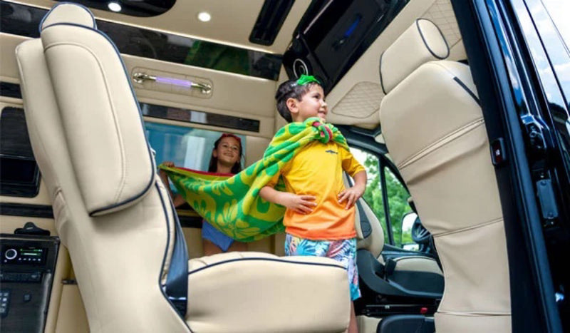  viewed from the rear.|Compare RV rental interior dimensions: standard 29-31" vs. Ultimate Toys' 44" for more spacious & comfortable designs.|This RV rental interior layout shows front seats — photo 15