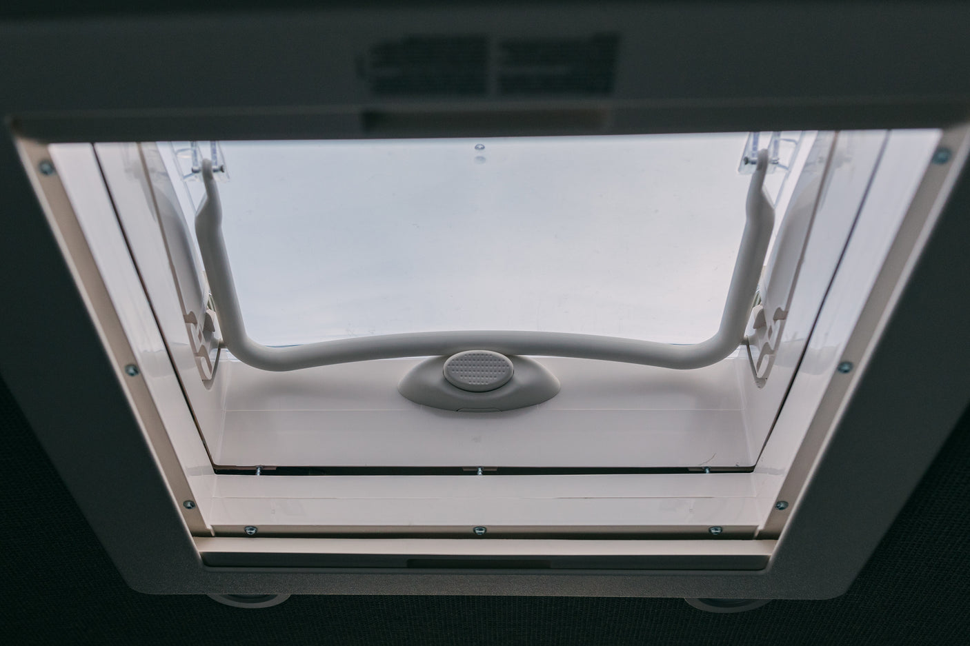 This RV rental features an open skylight/roof vent, revealing the white handle mechanism for fresh air and natural light inside.