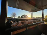 RV rental cargo view at sunrise: water/fuel containers securely stored. Essential gear for adventure travel.