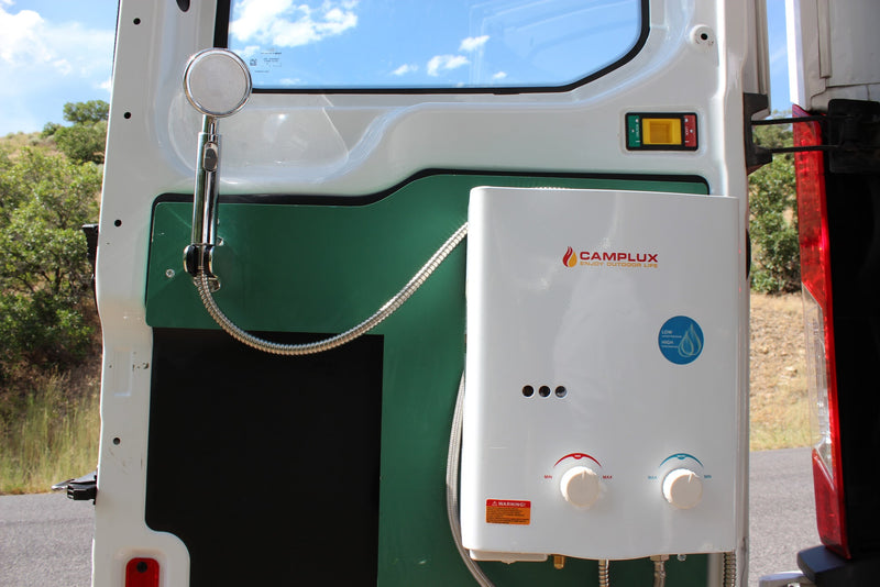Back of RV rental features a Camplux portable hot water heater and outdoor shower for adventure camping and van life. — photo 5