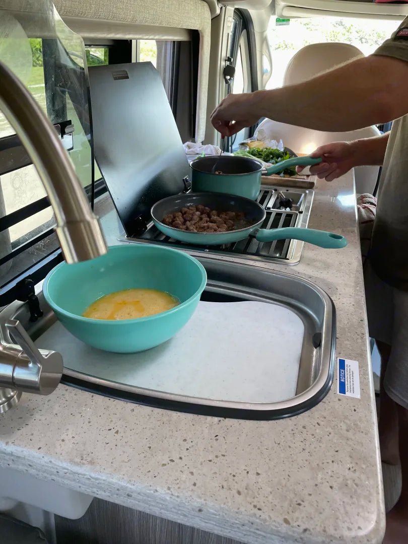  and kitchenette with sink/cooktop. Ready for adventures!|This black RV rental — photo 6