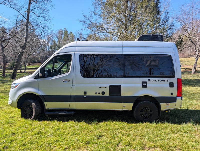  and a compact kitchen.|Rear of a silver Thor Sanctuary Sprinter RV rental with a bike rack — photo 15