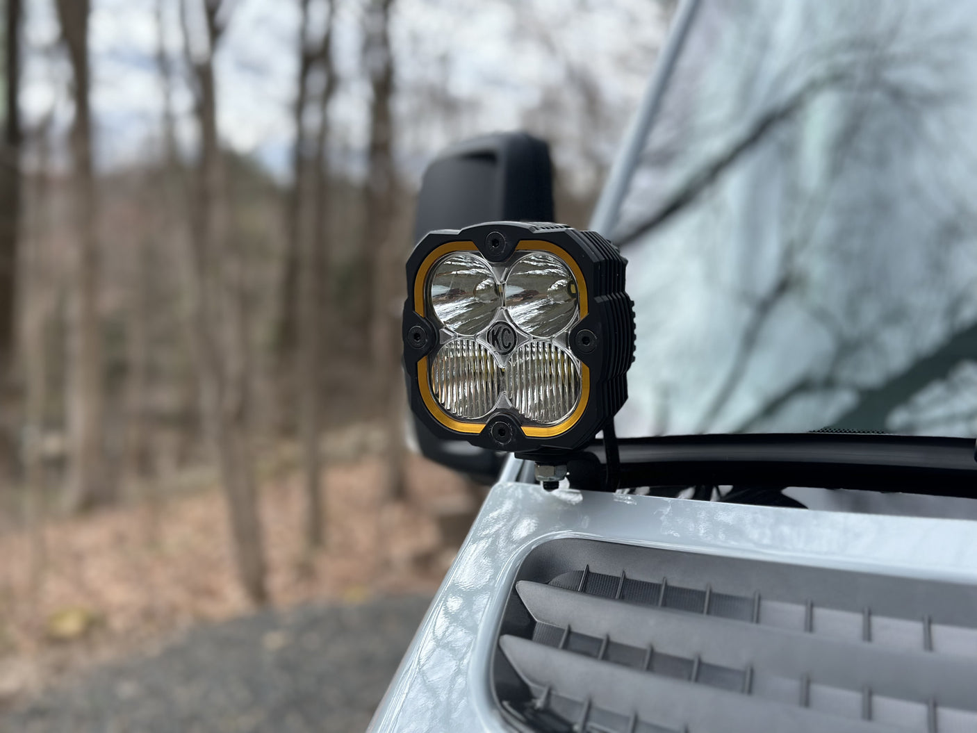 Front view of a powerful KC HiLiTES auxiliary light on an RV, enhancing visibility for your adventurous rv rental journeys.
