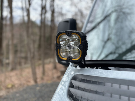 Front view of a powerful KC HiLiTES auxiliary light on an RV, enhancing visibility for your adventurous rv rental journeys.