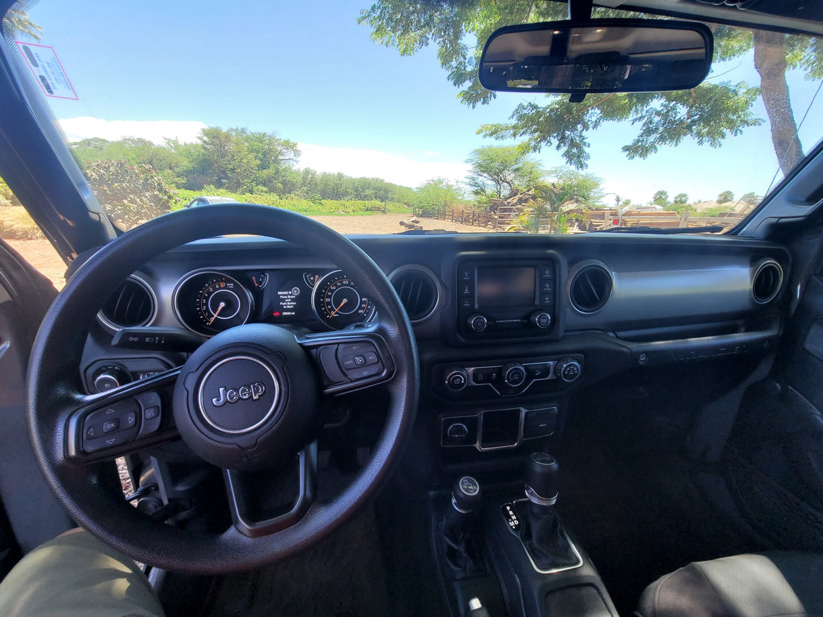 Jeep Wrangler interior showing 25,033 mi on dash. Scenic view for a journey, like an adventurous RV rental trip. — photo 13