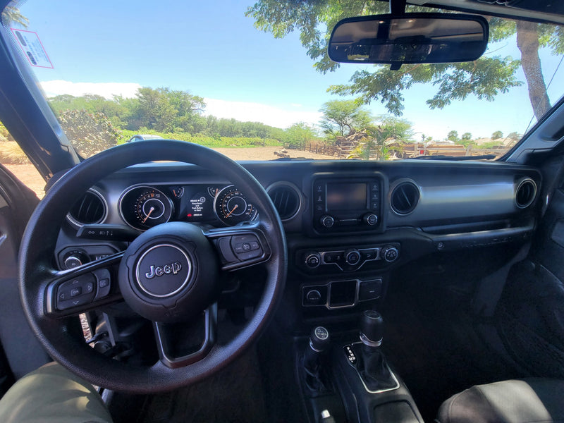 Jeep Wrangler interior showing 25,033 mi on dash. Scenic view for a journey, like an adventurous RV rental trip. — photo 13